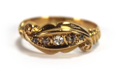 Lot 526 - An 18ct yellow gold ring set five small...