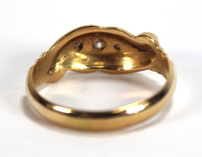 Lot 526 - An 18ct yellow gold ring set five small...