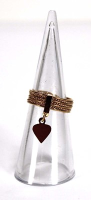 Lot 528 - An 18ct yellow gold seven band ring with heart...