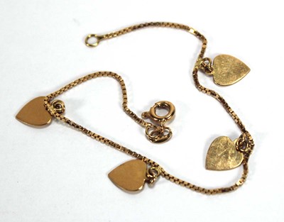 Lot 528 - An 18ct yellow gold seven band ring with heart...