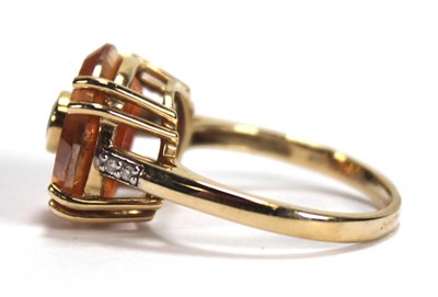 Lot 536 - A 9ct yellow gold Lehrer ring set padparadscha...