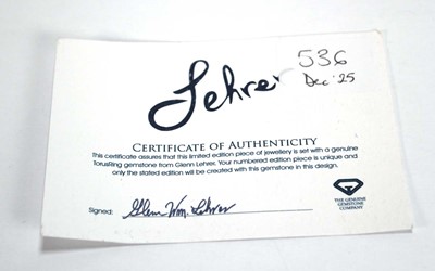 Lot 536 - A 9ct yellow gold Lehrer ring set padparadscha...