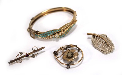 Lot 541 - A 9ct yellow gold bar brooch set red stone and...