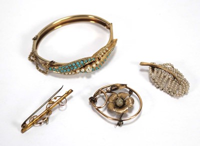 Lot 541 - A 9ct yellow gold bar brooch set red stone and...