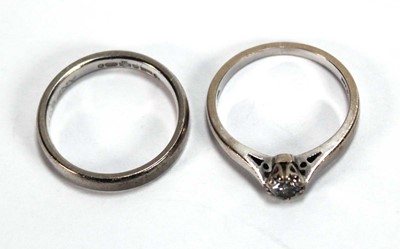 Lot 543 - An 18ct white gold ring set small brilliant...