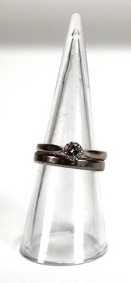 Lot 543 - An 18ct white gold ring set small brilliant...