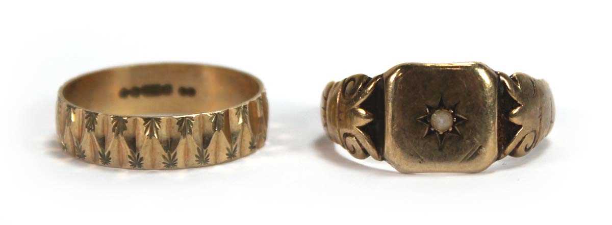 Lot 547 - A 9ct yellow gold facet cut band ring, London...