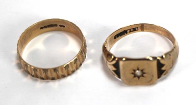 Lot 547 - A 9ct yellow gold facet cut band ring, London...