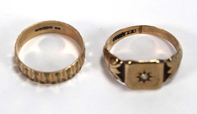 Lot 547 - A 9ct yellow gold facet cut band ring, London...