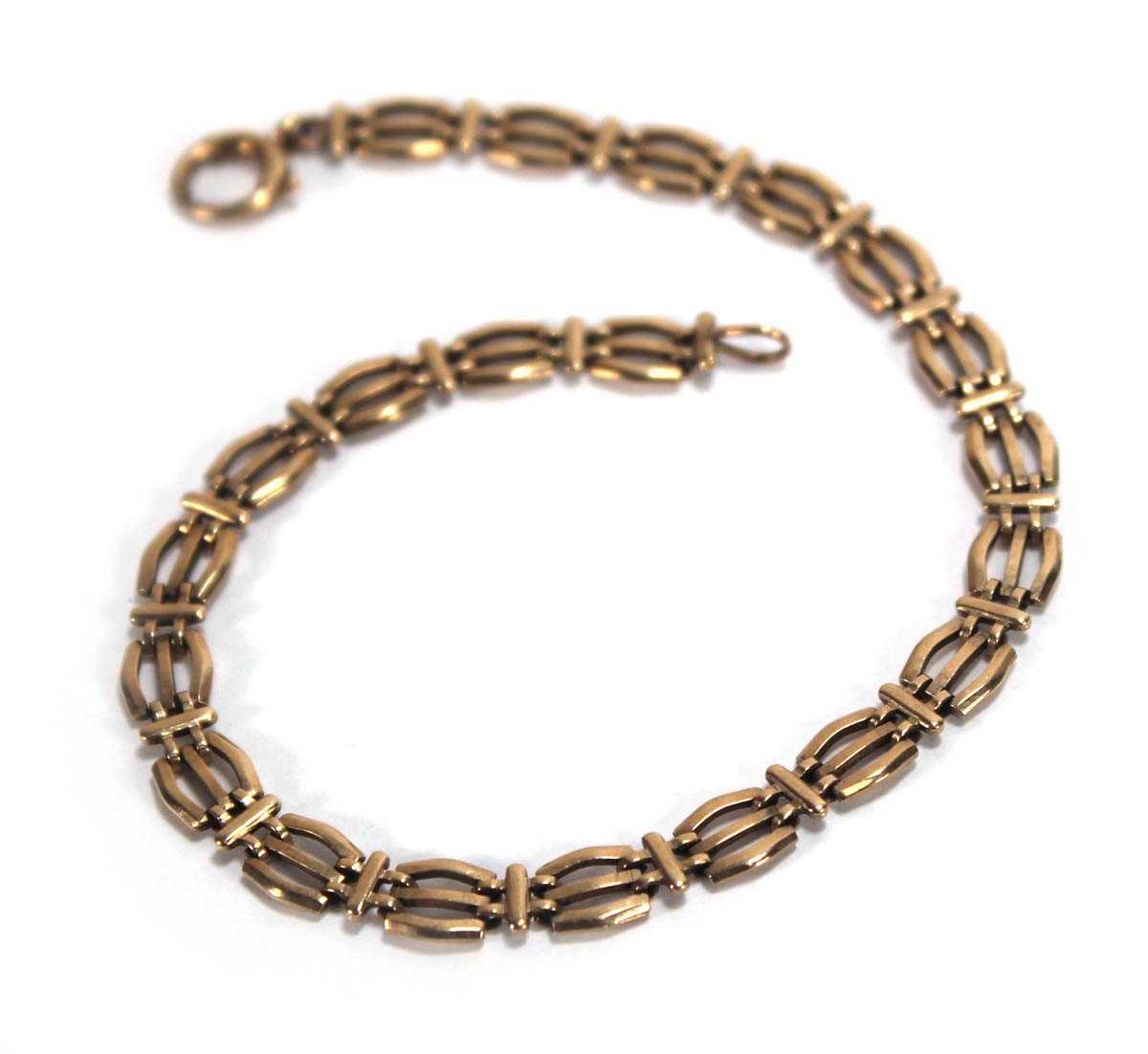 Lot 553 - A 9ct yellow gold three bar gatelink bracelet,...