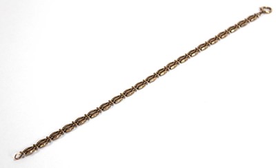 Lot 553 - A 9ct yellow gold three bar gatelink bracelet,...