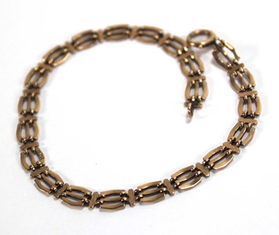 Lot 553 - A 9ct yellow gold three bar gatelink bracelet,...