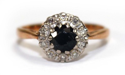 Lot 556 - An 18ct yellow gold cluster ring set round cut...
