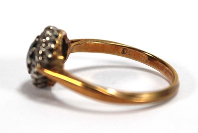 Lot 556 - An 18ct yellow gold cluster ring set round cut...
