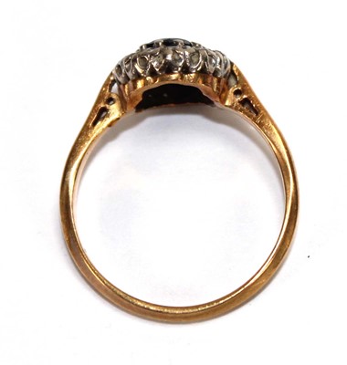 Lot 556 - An 18ct yellow gold cluster ring set round cut...