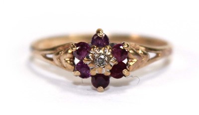 Lot 561 - A 9ct yellow gold cluster ring set small...