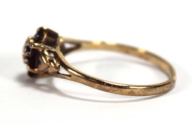 Lot 561 - A 9ct yellow gold cluster ring set small...