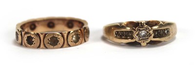 Lot 562 - A 9ct yellow gold ring set small diamonds in...