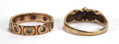 Lot 562 - A 9ct yellow gold ring set small diamonds in...