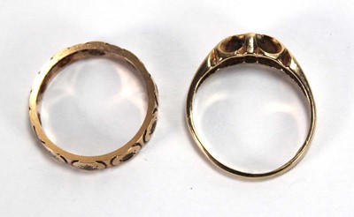 Lot 562 - A 9ct yellow gold ring set small diamonds in...