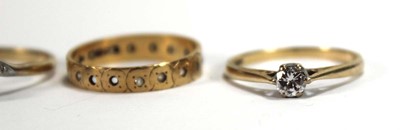 Lot 568 - An 18ct yellow gold ring set small diamond,...