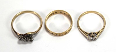 Lot 568 - An 18ct yellow gold ring set small diamond,...