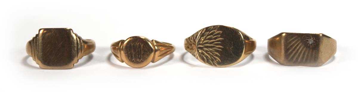 Lot 569 - Four 9ct yellow gold signet rings, various...