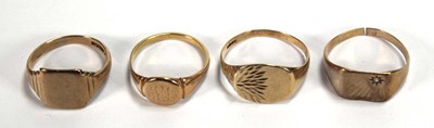 Lot 569 - Four 9ct yellow gold signet rings, various...