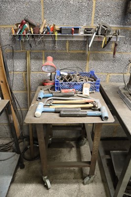 Lot 27 - A range of various hand tools on a small bench...