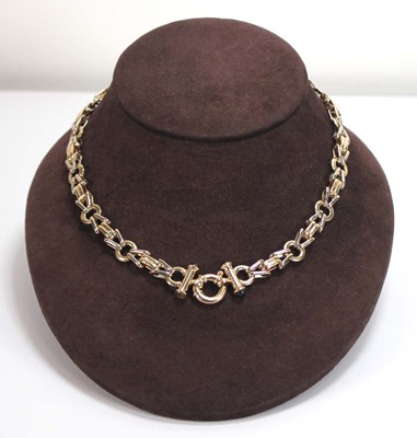 Lot 573 - A 9ct two-colour gold fancy link necklace, the...