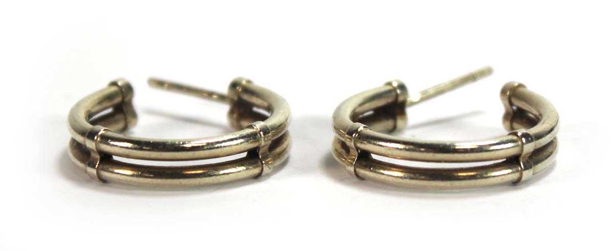 Lot 575 - A pair of 9ct yellow gold double hoop earrings,...