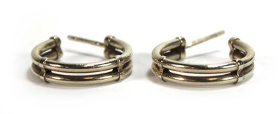 Lot 575 - A pair of 9ct yellow gold double hoop earrings,...