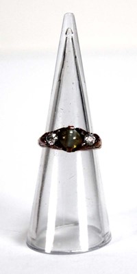 Lot 576 - An 18ct yellow gold ring set cabochon tigers...