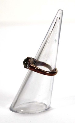 Lot 576 - An 18ct yellow gold ring set cabochon tigers...