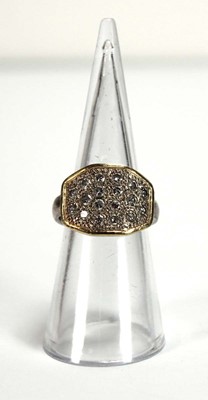 Lot 577 - An 18ct two-colour gold ring pave set eighteen...