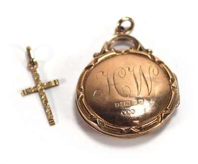 Lot 579 - An Edwardian 9ct yellow gold locket set red...
