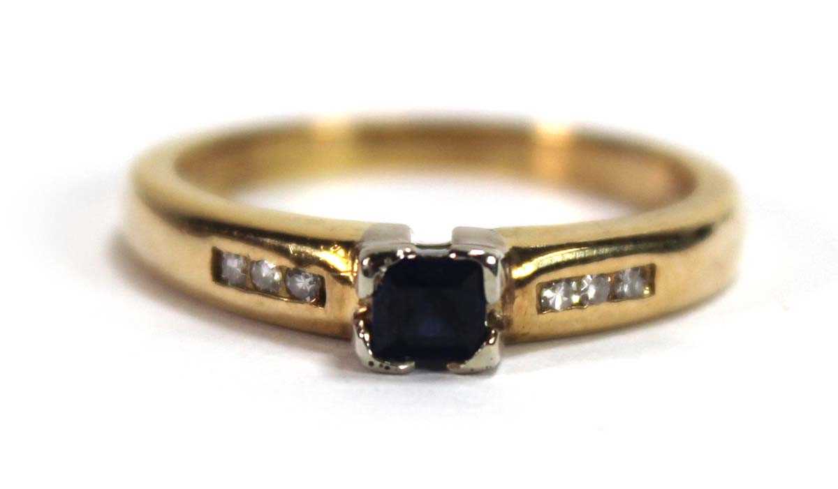Lot 580 - An 18ct yellow gold ring set a square cut...