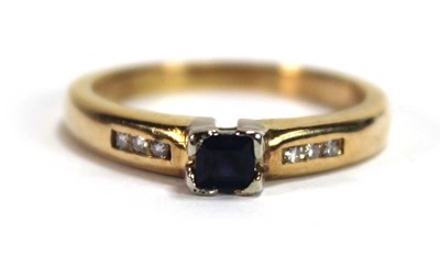Lot 580 - An 18ct yellow gold ring set a square cut...
