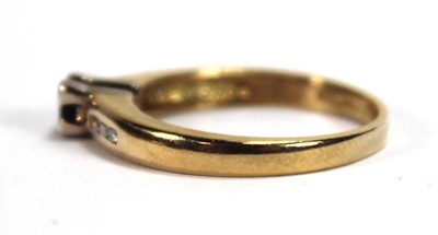 Lot 580 - An 18ct yellow gold ring set a square cut...