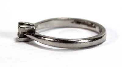 Lot 583 - A platinum ring set princess cut diamond in a...