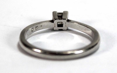 Lot 583 - A platinum ring set princess cut diamond in a...