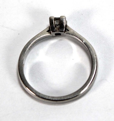Lot 583 - A platinum ring set princess cut diamond in a...