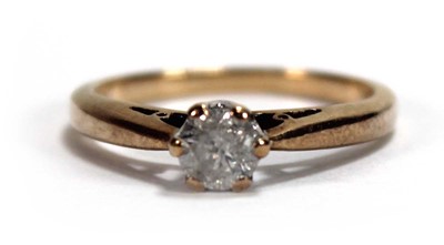 Lot 584 - A 9ct yellow gold ring set brilliant cut...