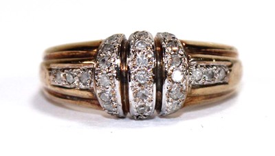 Lot 585 - A 9ct yellow gold ring set three bands of...