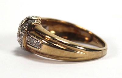 Lot 585 - A 9ct yellow gold ring set three bands of...