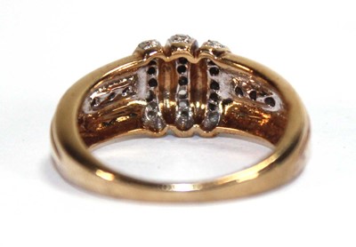 Lot 585 - A 9ct yellow gold ring set three bands of...