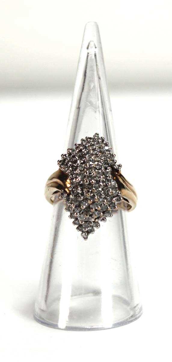 Lot 586 - A 9ct yellow gold ring set small diamonds in a...