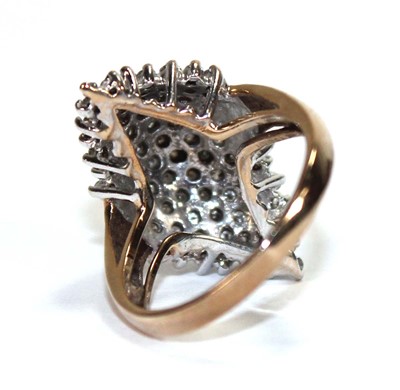 Lot 586 - A 9ct yellow gold ring set small diamonds in a...