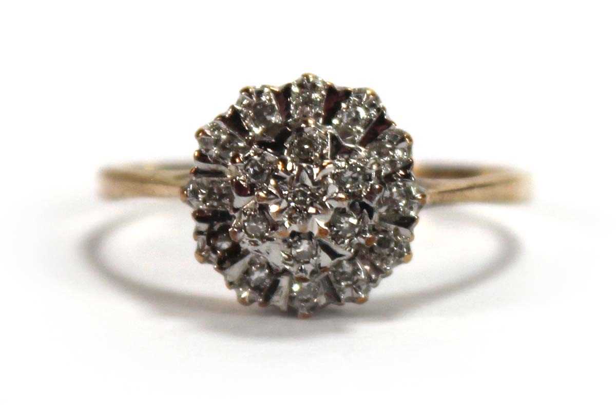 Lot 587 - A 9ct yellow gold three tier cluster ring set...