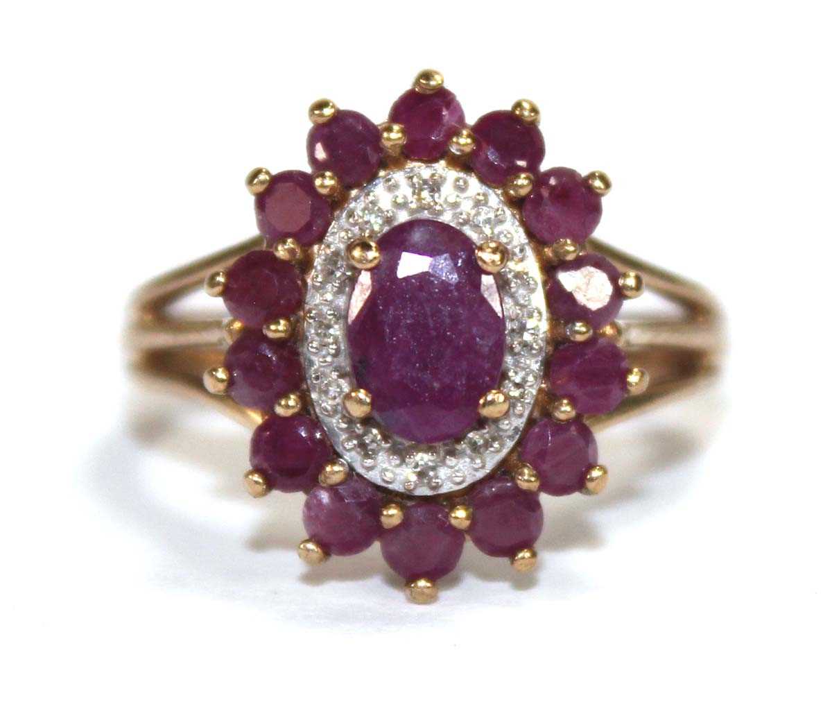 Lot 588 - A 9ct yellow gold cluster ring set three tiers...